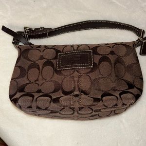 Gently used small brown coach purse. Very clean outside and inside.